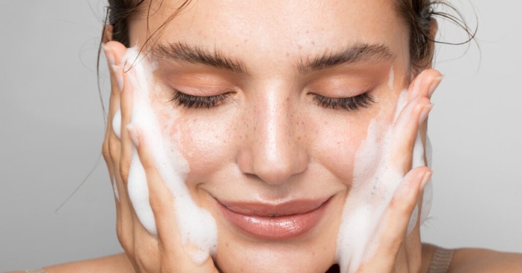 wash face from oil free cleanser to take care for oily skin